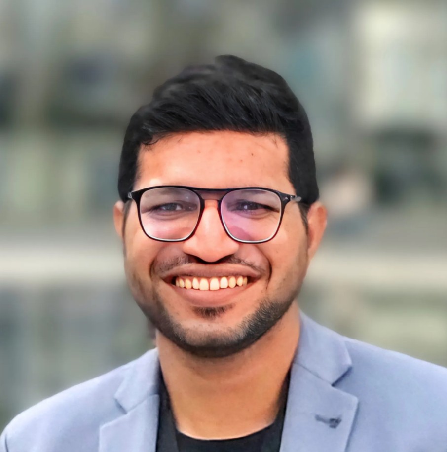 Lavneet Bansal smiling in a light blue blazer